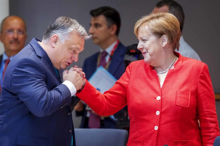 Viktor Orban with Angela Merkel
