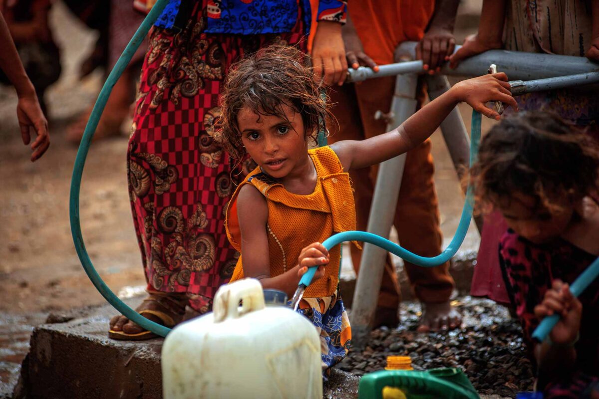 A girl fetch water provided by Solidarités International, an EU-supported aid group